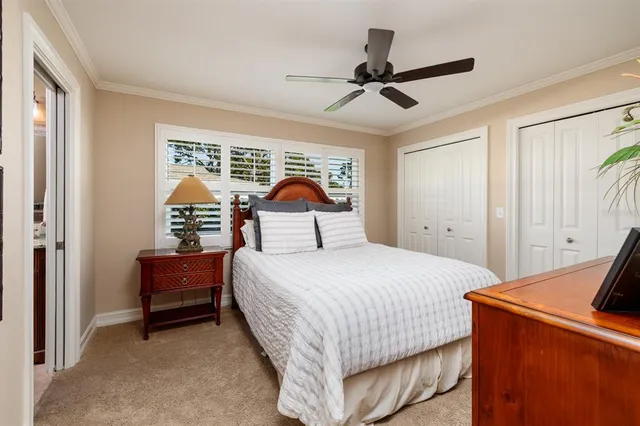 a bathroom with a granite countertop sink a mirror and shower
