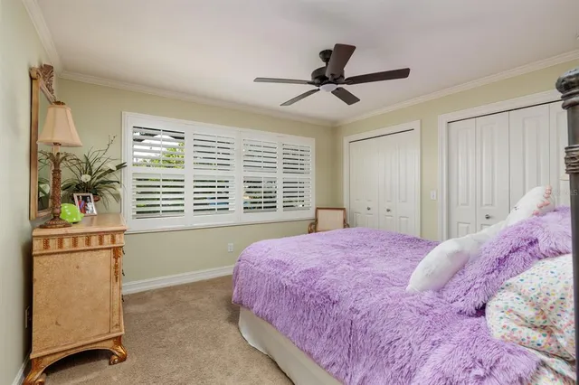 a bathroom with a granite countertop sink toilet a large mirror a shower and a bathtub