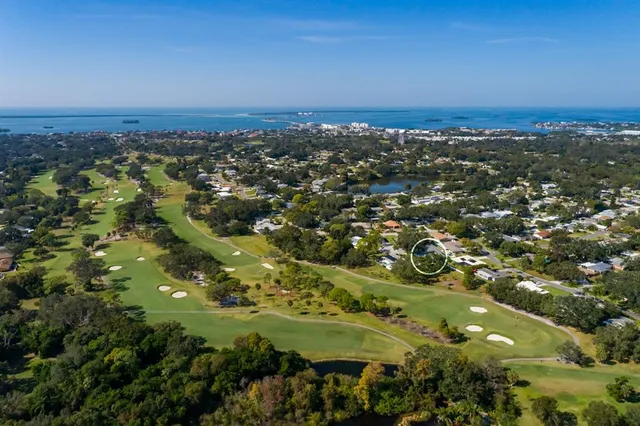 a view of a sign board with a yard