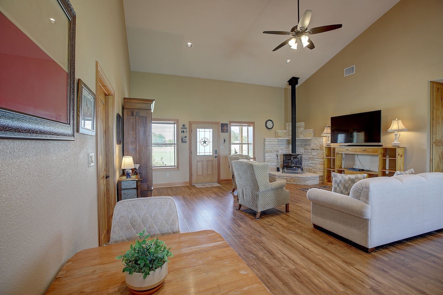 9414 Laird Road Round Top, TX 78954 - Photo 18 of 50 Interior of the home Living space showing vaulted ceiling and pot belly stove that is wood burning