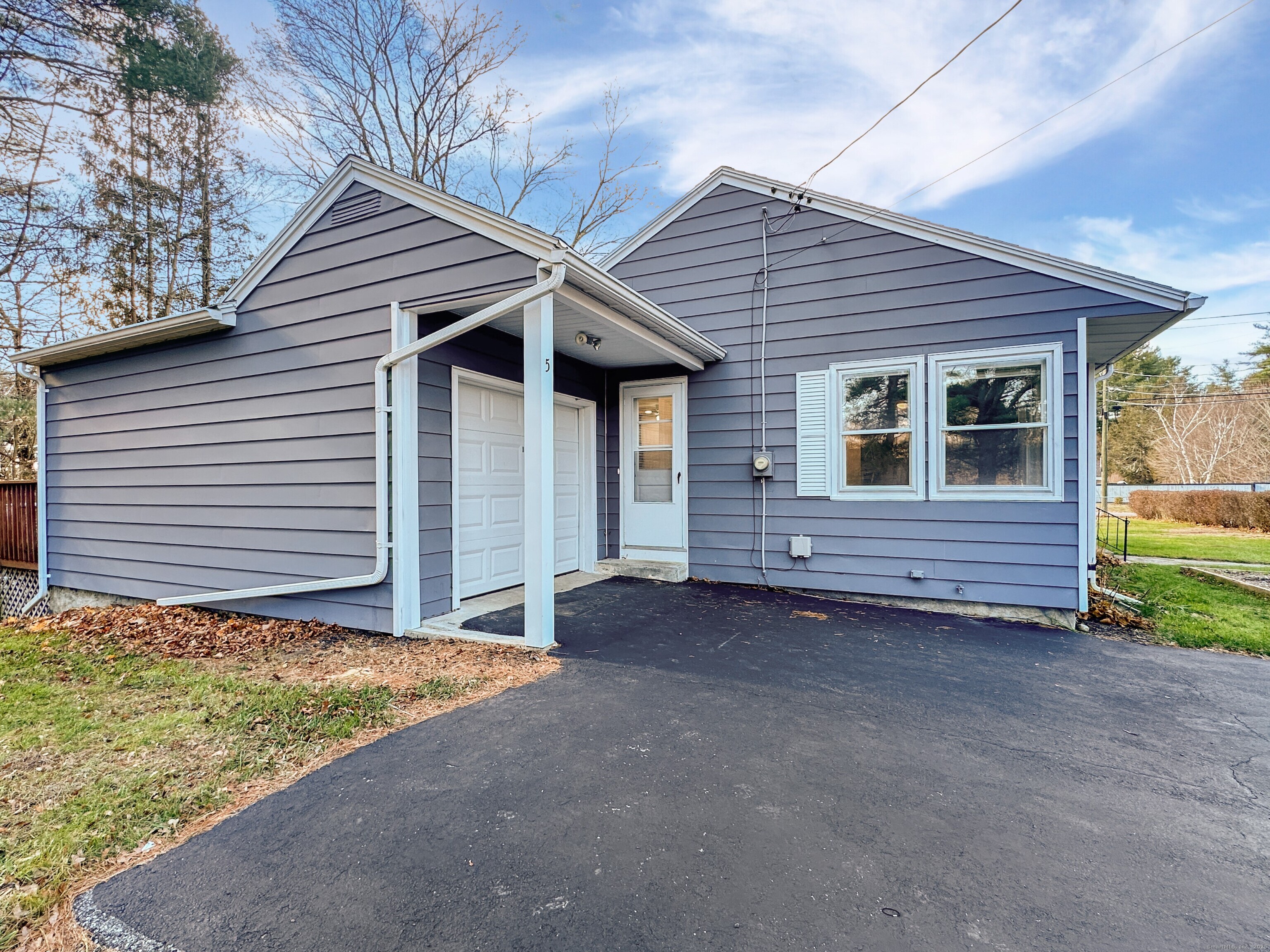 5 Chappell Street Chaplin, CT 06235 - Photo 11 of 40 a view of house with small yard and wooden fence