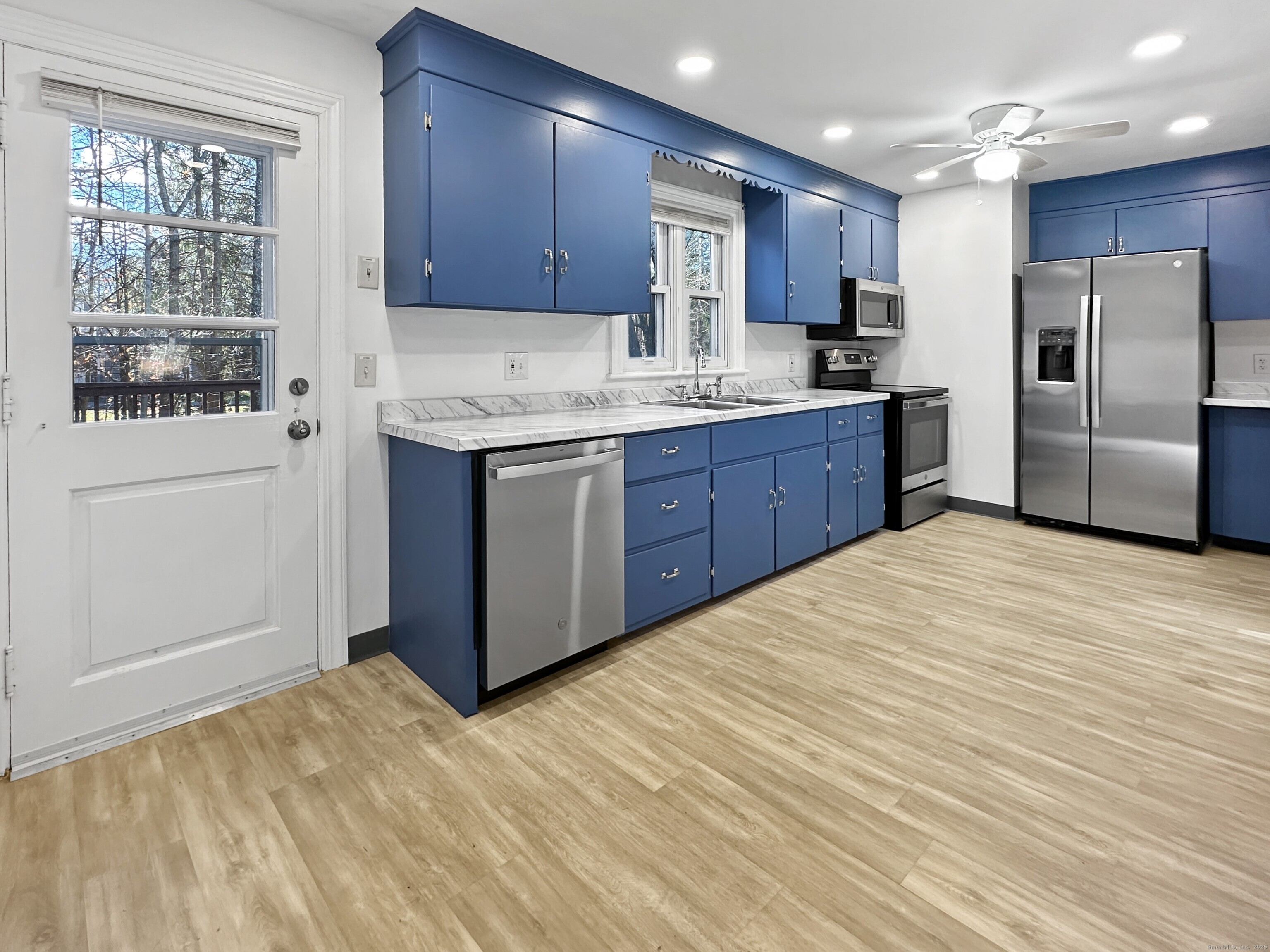 5 Chappell Street Chaplin, CT 06235 - Photo 14 of 40 a kitchen with stainless steel appliances granite countertop a refrigerator sink and wooden cabinets