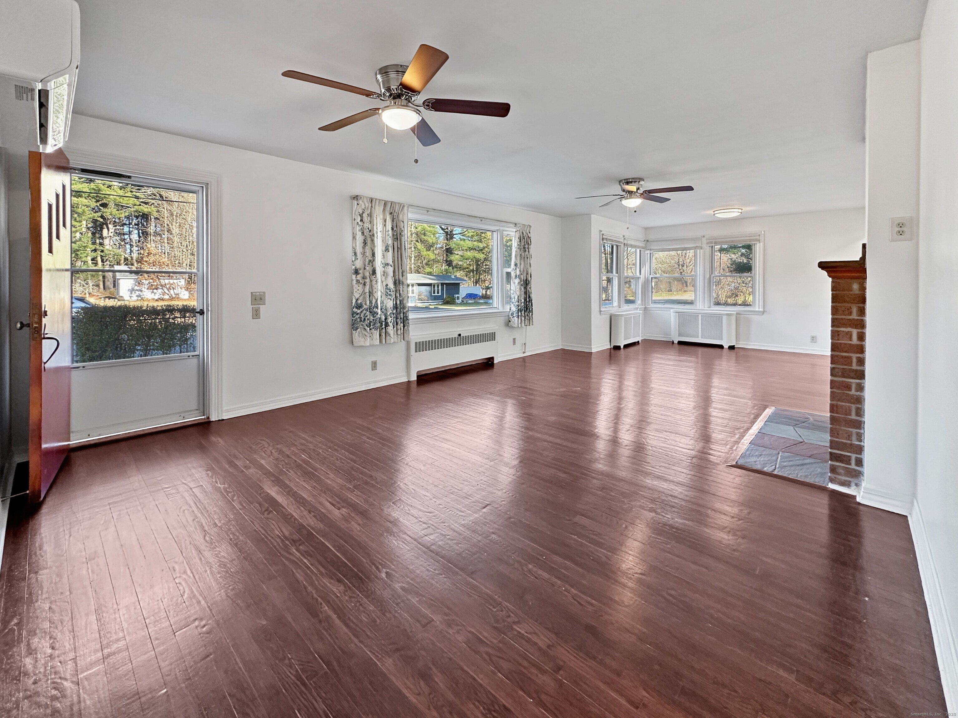 5 Chappell Street Chaplin, CT 06235 - Photo 20 of 40 a view of an empty room with wooden floor and a window