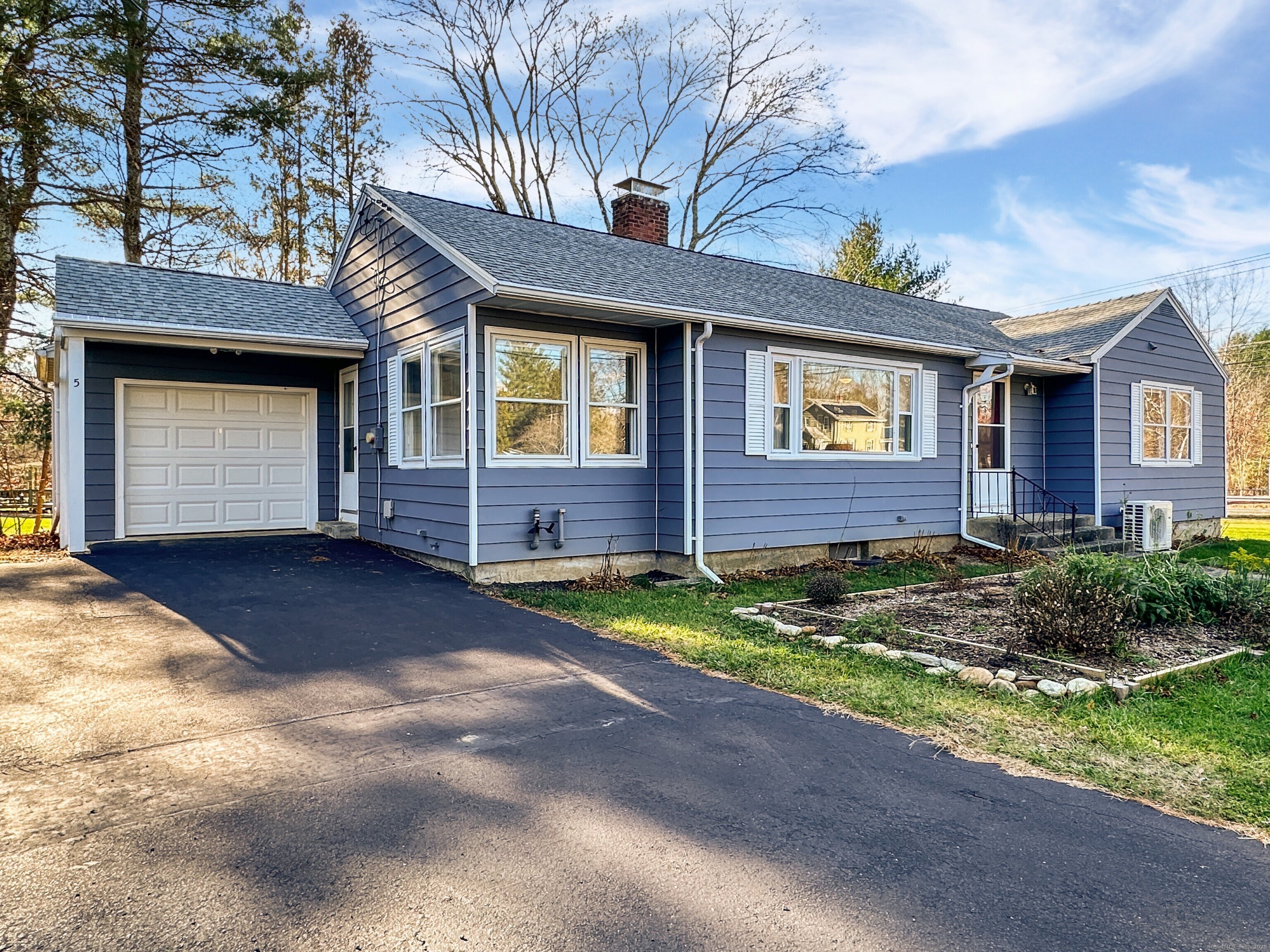 5 Chappell Street Chaplin, CT 06235 - Photo 2 of 40 a view of a brick house with a yard and large tree