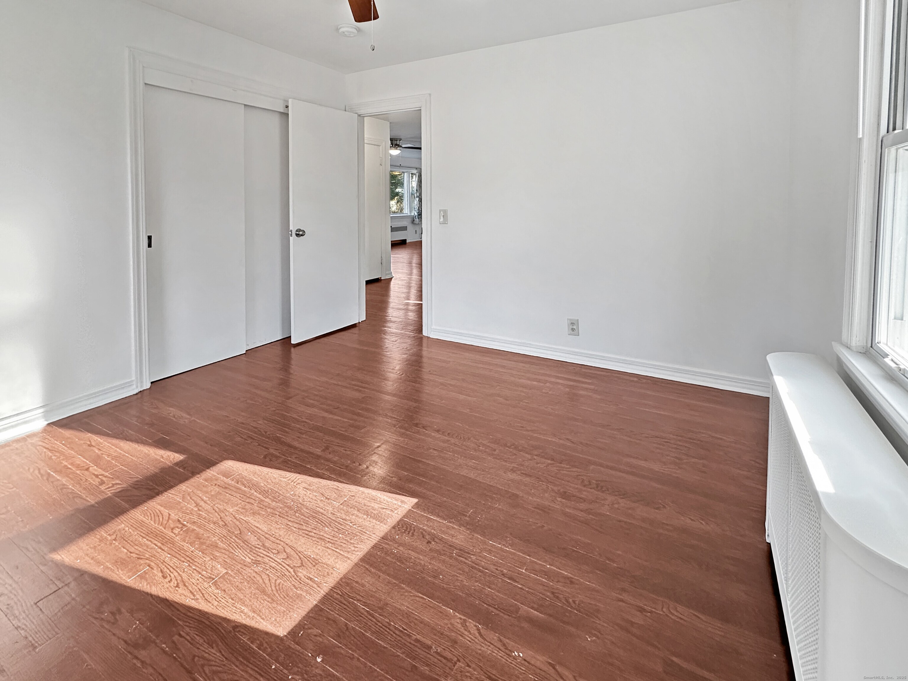 5 Chappell Street Chaplin, CT 06235 - Photo 26 of 40 an empty room with wooden floor