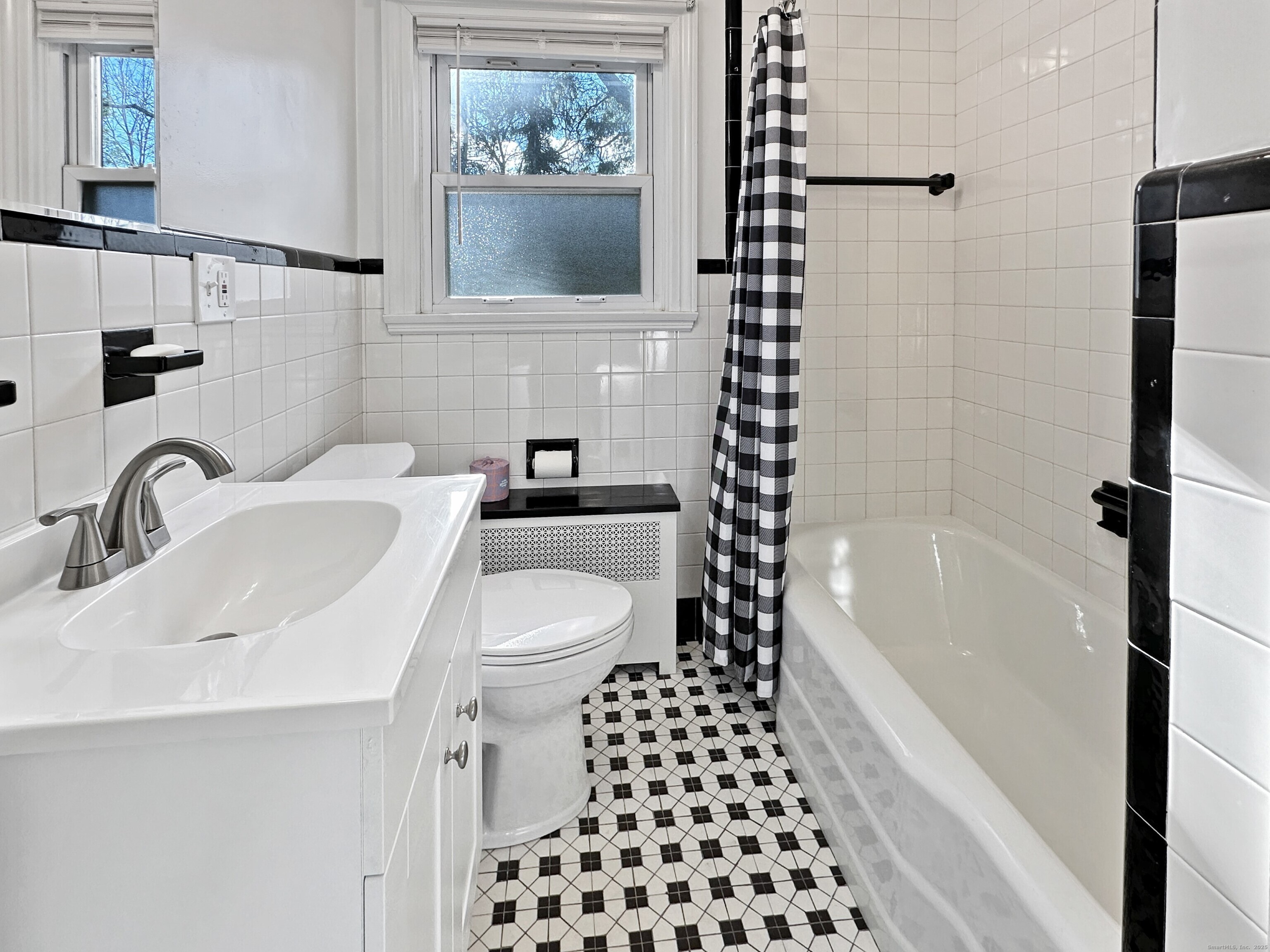 5 Chappell Street Chaplin, CT 06235 - Photo 27 of 40 a bathroom with a sink a toilet and shower