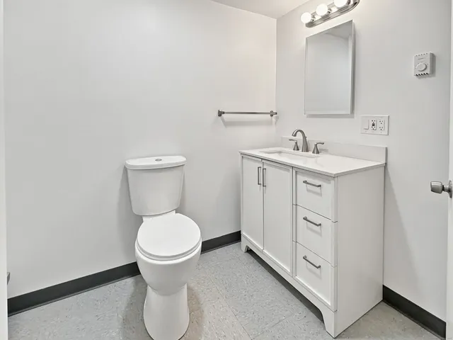 a view of a livingroom with stairs and furniture