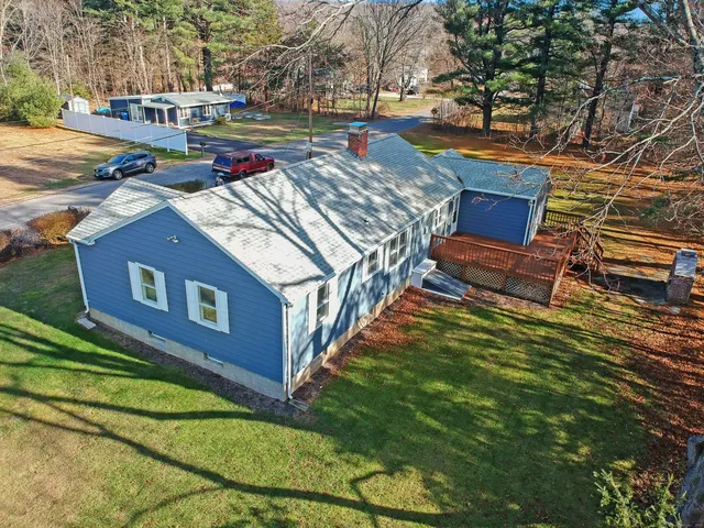 a backyard of a house with outdoor seating