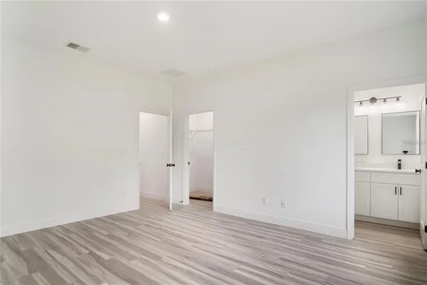 a view of a bathroom with wooden floor