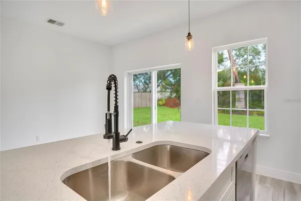 a kitchen with a sink and a window