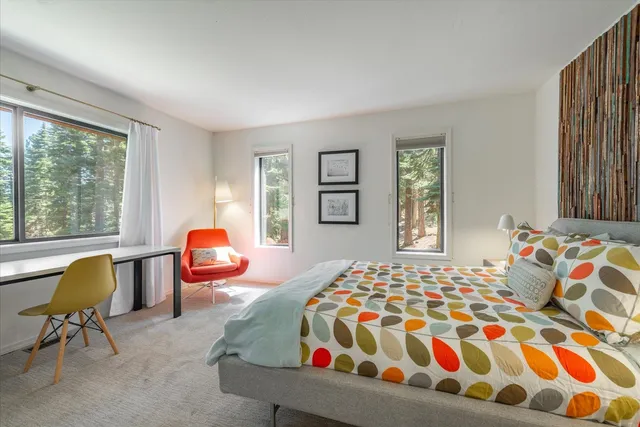 a bedroom with bed and window