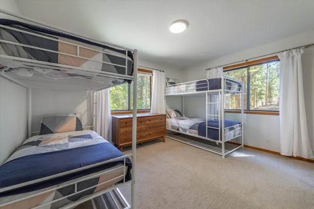 a bedroom with furniture and a window