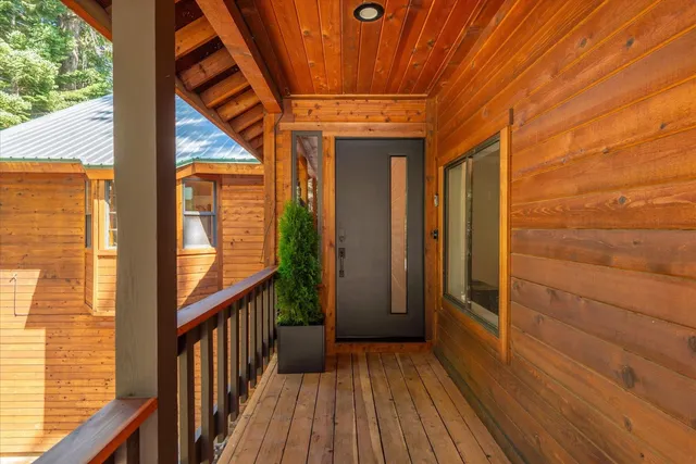 a view of balcony with wooden floor