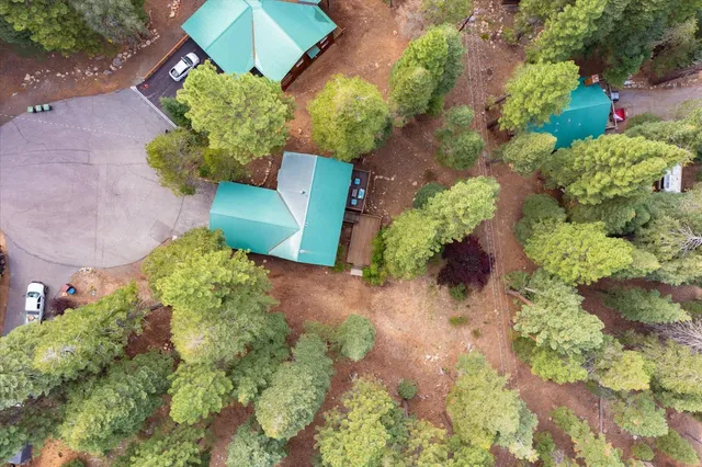 an aerial view of a house with a yard and a garden