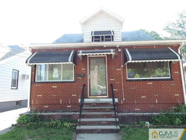 1801 Rutherford Street Rahway, NJ 07065 - Photo 1 of 10 a front view of a house with a yard