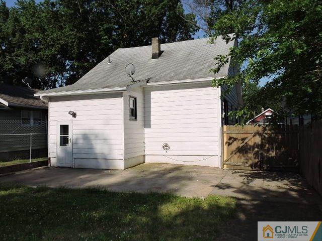1801 Rutherford Street Rahway, NJ 07065 - Photo 10 of 10 a view of backyard of house with wooden fence