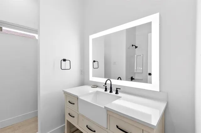a bathroom with a sink and a mirror