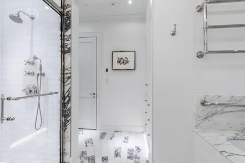 a bathroom with a bathtub and shower