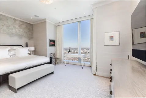 a bedroom with furniture and white walls