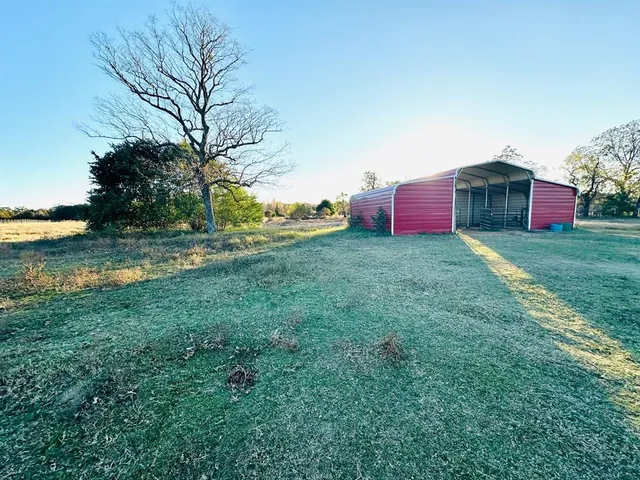 a backyard of a house with lots of green space