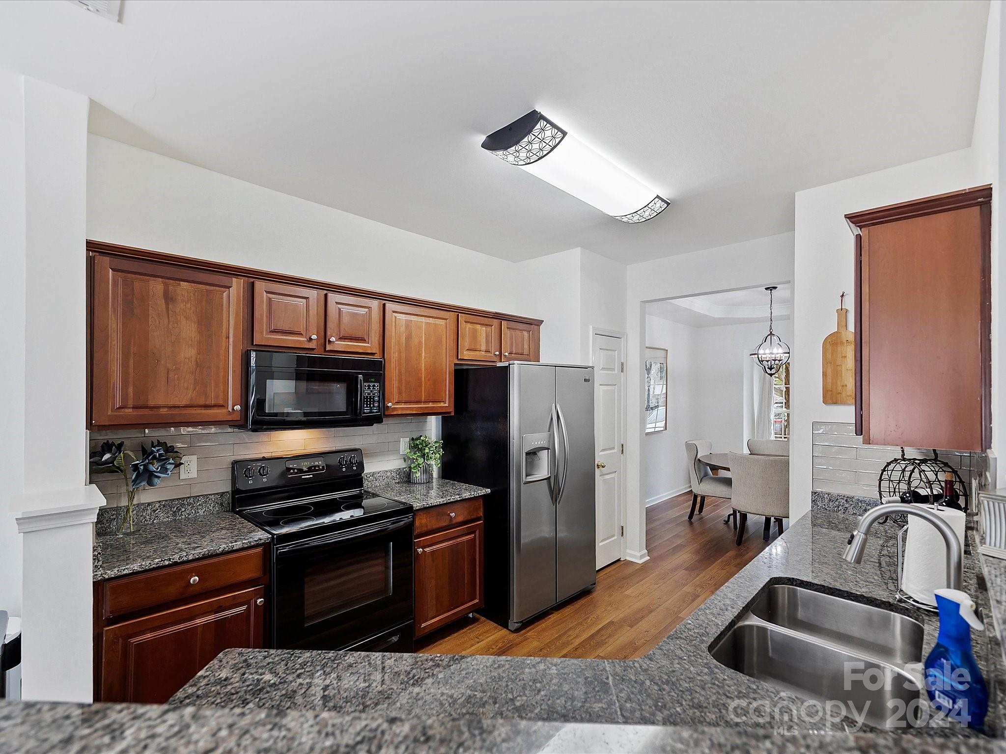 117 Snead Road Fort Mill, SC 29715 - Photo 12 of 36 a kitchen with stainless steel appliances granite countertop a refrigerator stove and sink