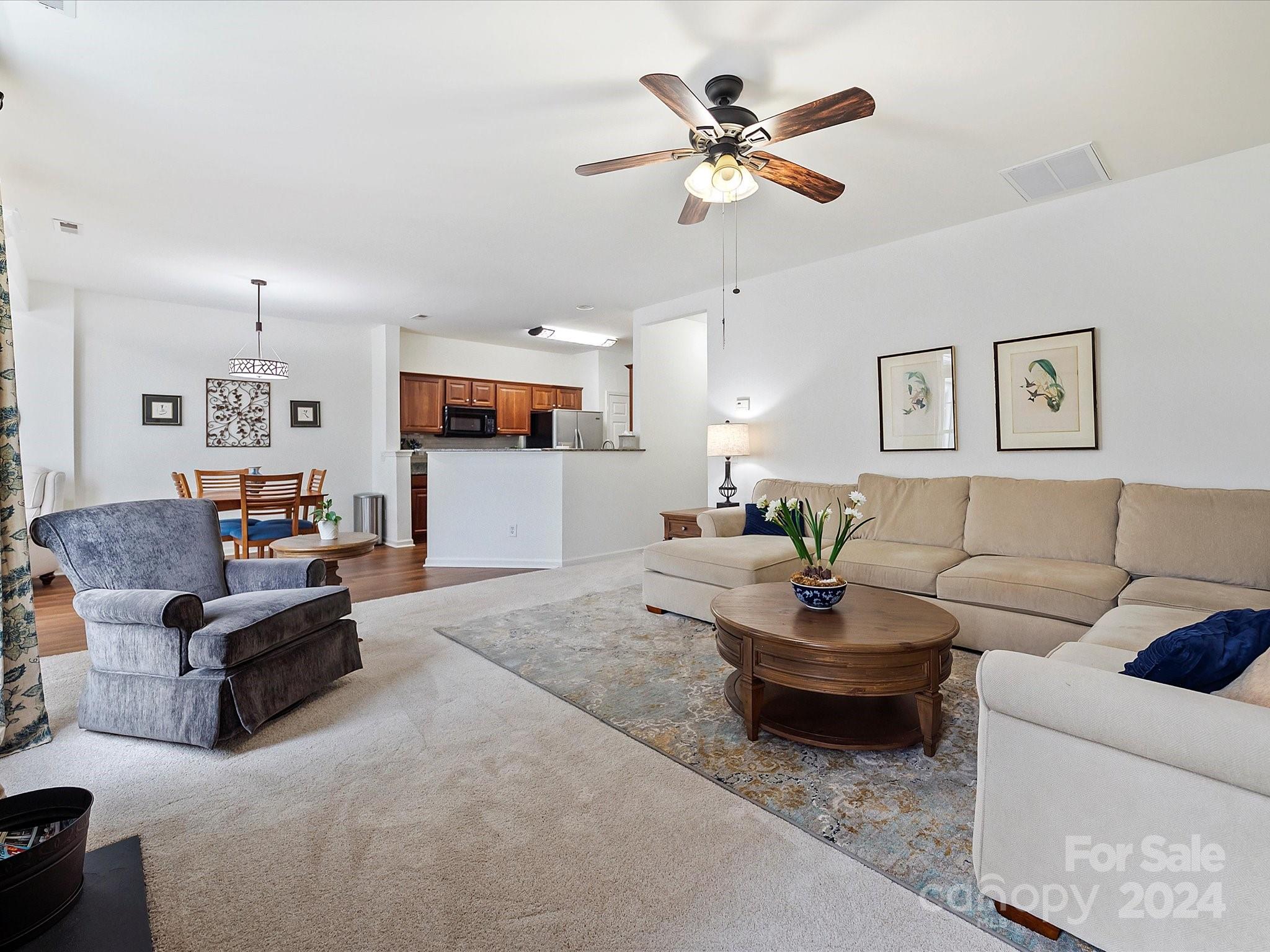 117 Snead Road Fort Mill, SC 29715 - Photo 21 of 36 a living room with furniture and a ceiling fan