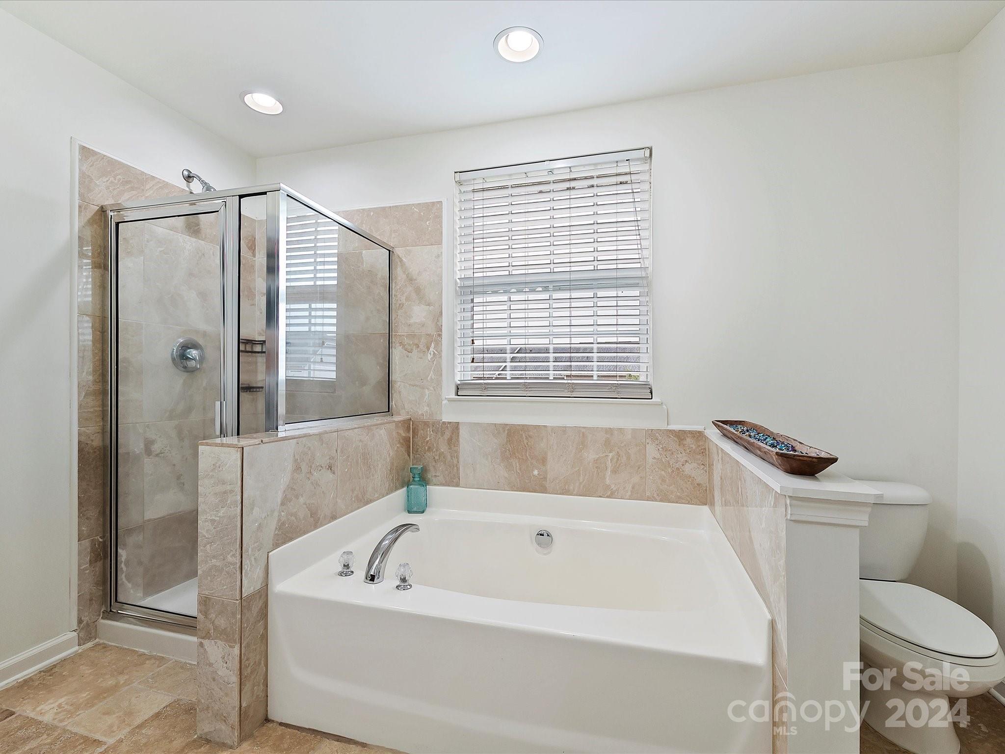 117 Snead Road Fort Mill, SC 29715 - Photo 27 of 36 a white bath tub sitting next to a toilet