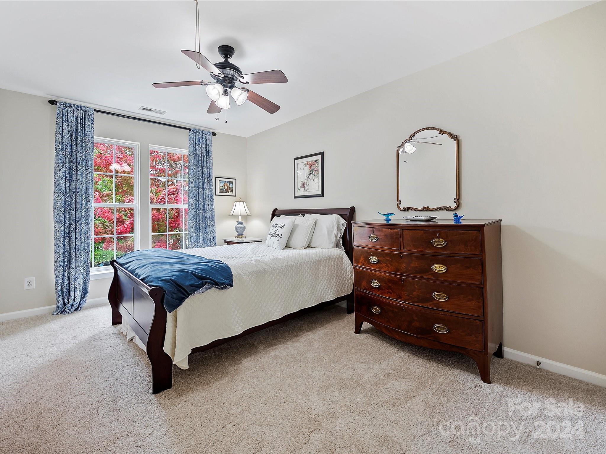 117 Snead Road Fort Mill, SC 29715 - Photo 28 of 36 a bedroom with a bed and a dresser
