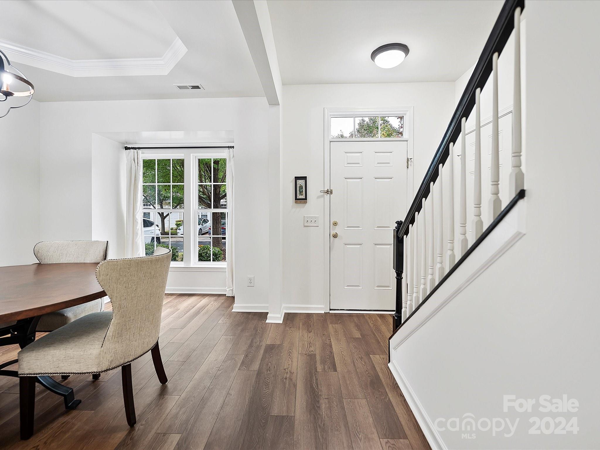 117 Snead Road Fort Mill, SC 29715 - Photo 4 of 36 a view of a livingroom with furniture wooden floor and staircase