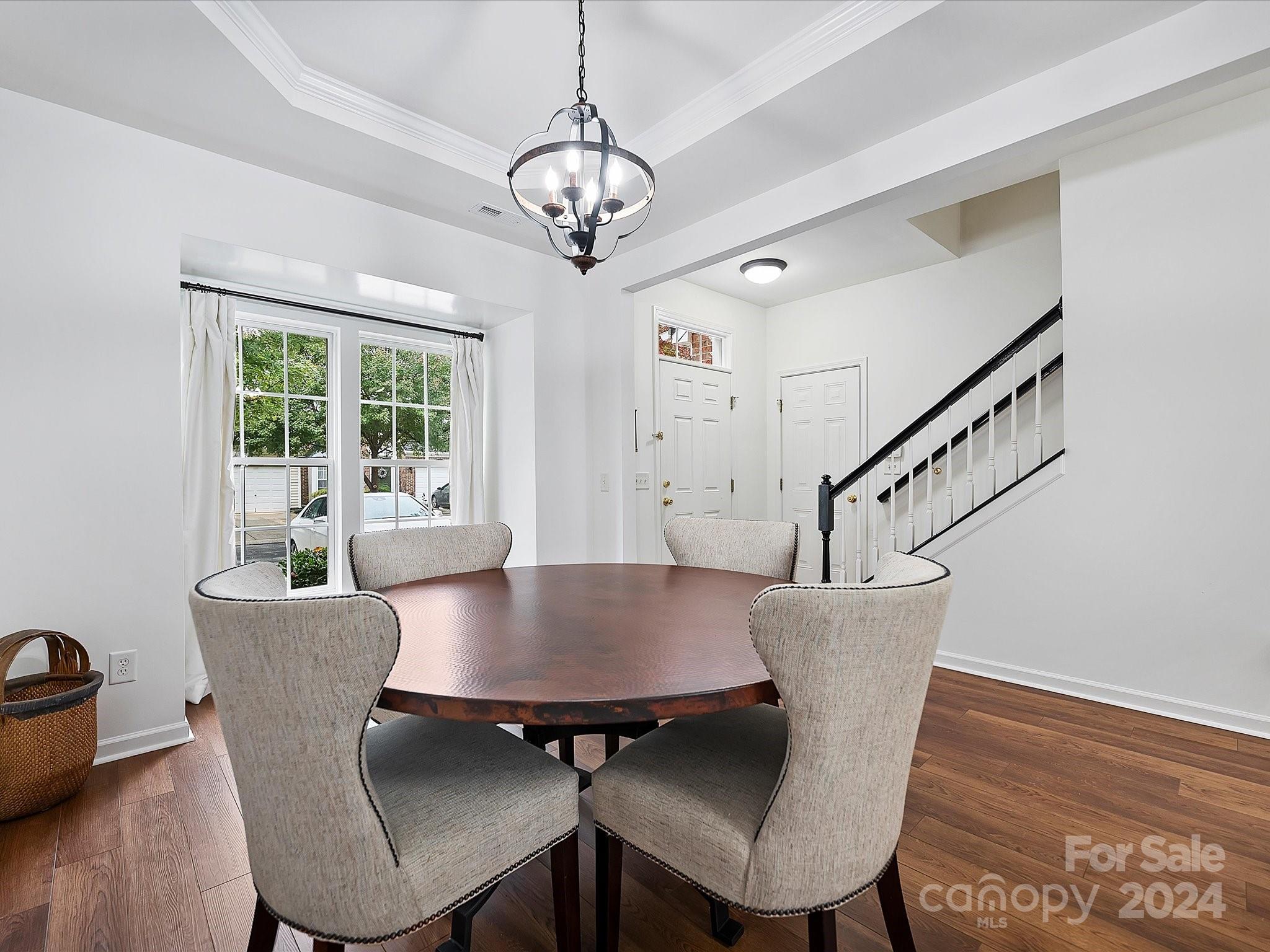 117 Snead Road Fort Mill, SC 29715 - Photo 6 of 36 a view of a dining room with furniture window and wooden floor