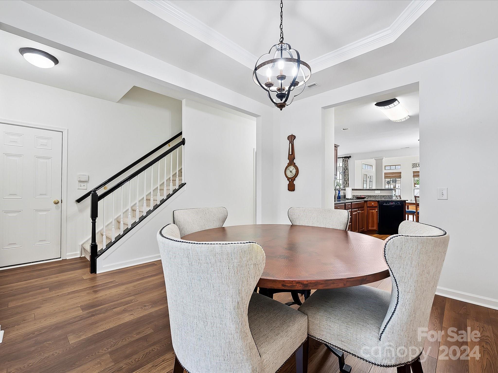 117 Snead Road Fort Mill, SC 29715 - Photo 7 of 36 a view of a dining room with furniture a rug and wooden floor