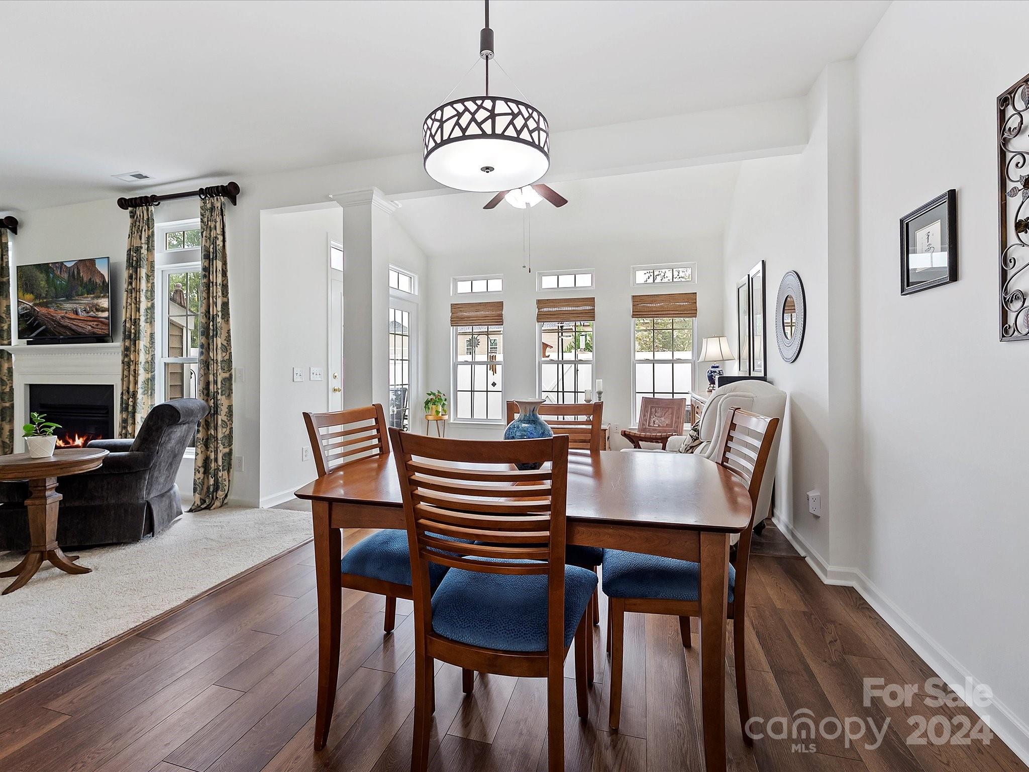 117 Snead Road Fort Mill, SC 29715 - Photo 10 of 36 a view of a dining room with furniture window and wooden floor