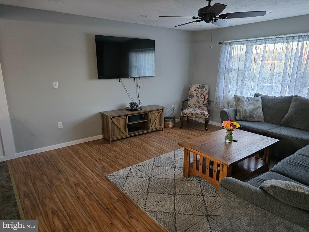 349 Basehoar School Road Littlestown, PA 17340 - Photo 8 of 31 a living room with furniture and a flat screen tv
