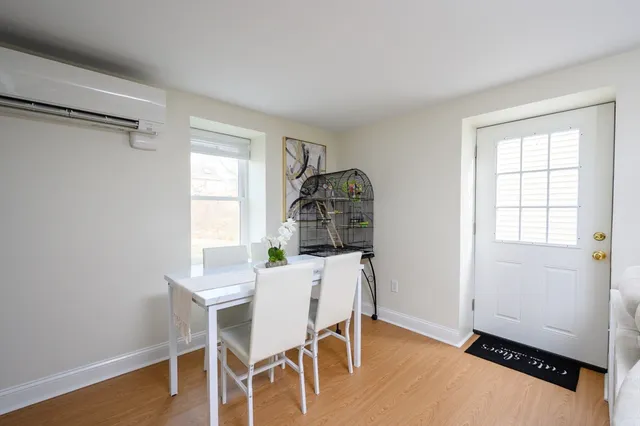 a dining room with furniture and window