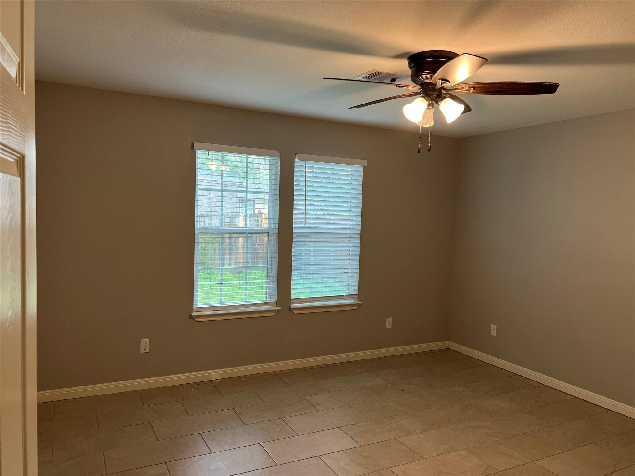 4114 Brown Street Bacliff, TX 77518 - Photo 4 of 12 a view of an empty room with a window