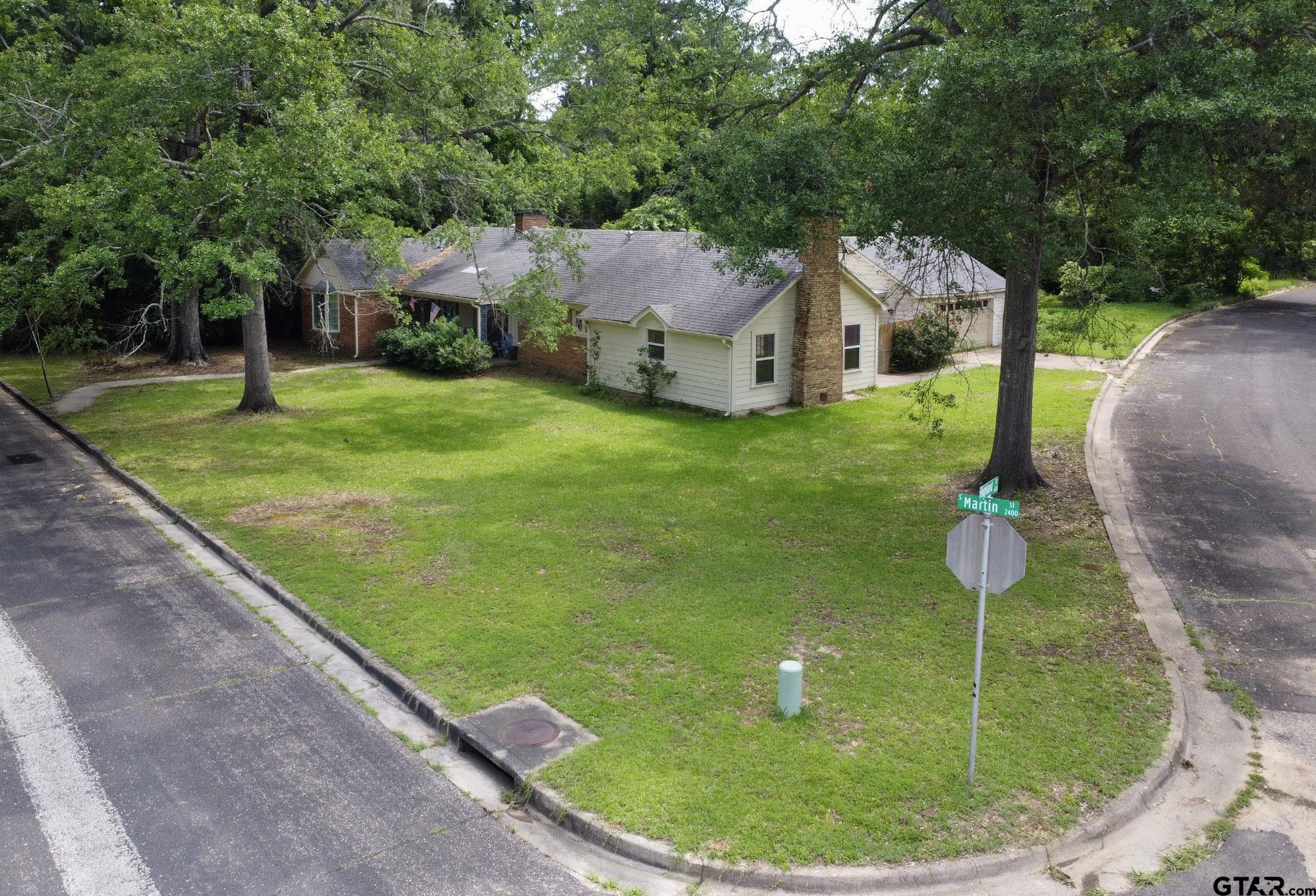 a house view with a garden space