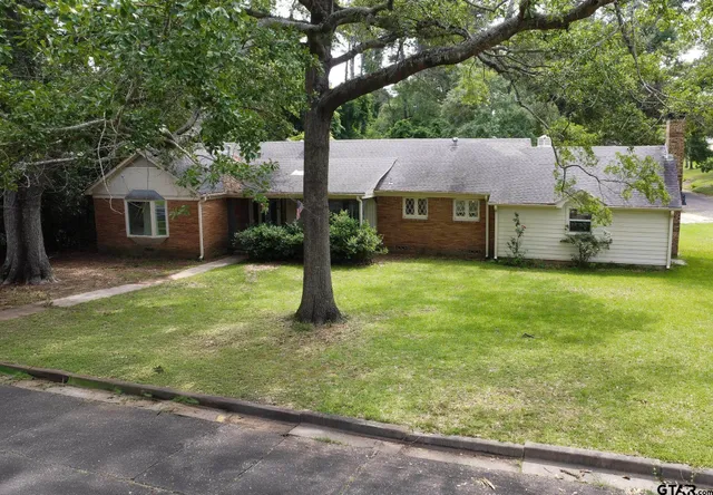 a house view with a garden space
