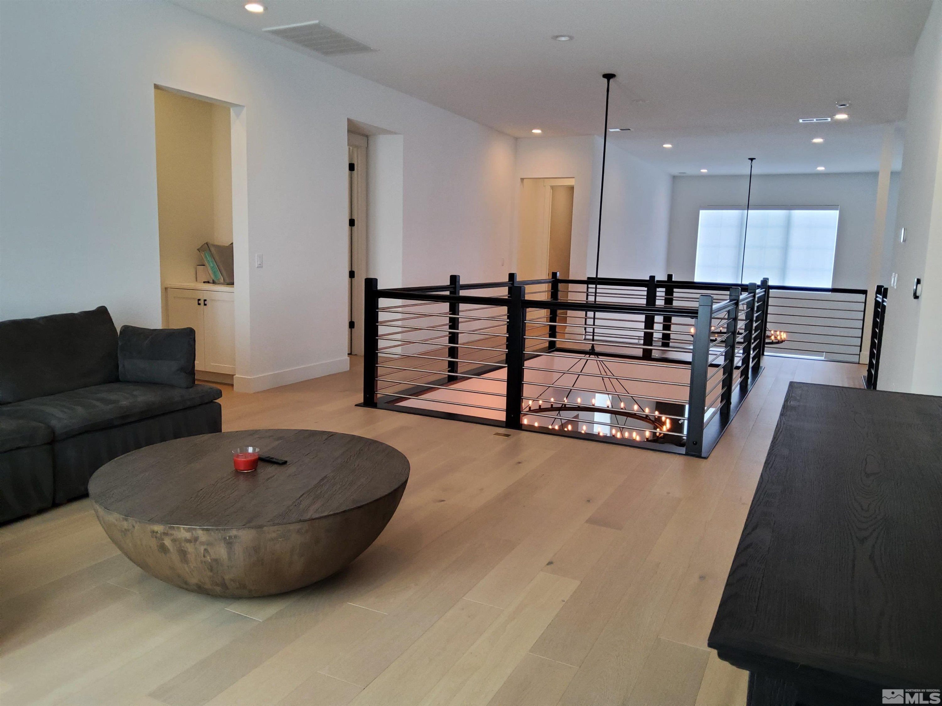 5449 Side Saddle Trail Reno, NV 89511 - Photo 17 of 35 a living room with couches and a table with wooden floor