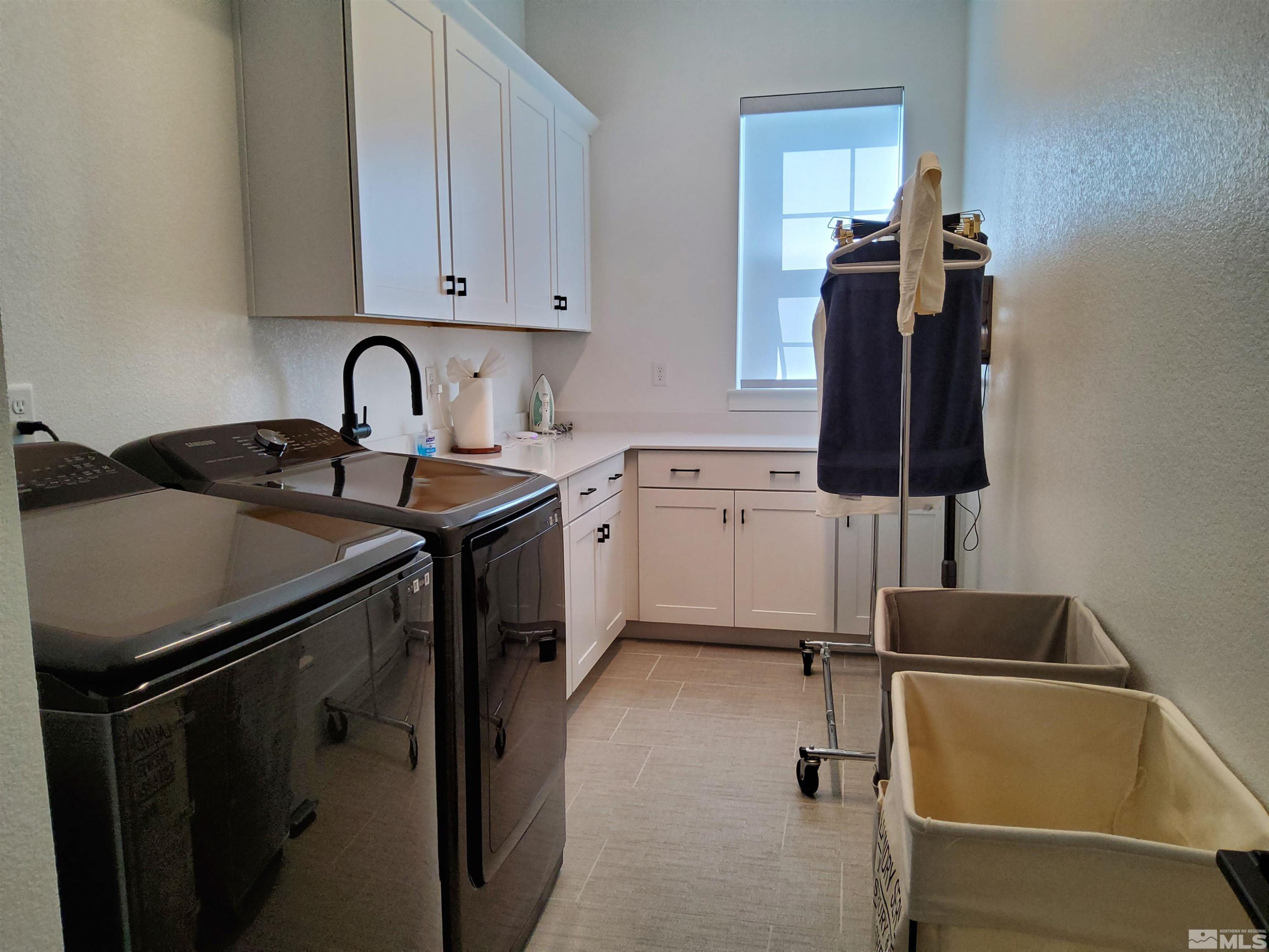 5449 Side Saddle Trail Reno, NV 89511 - Photo 20 of 35 a kitchen with a sink appliances and cabinets