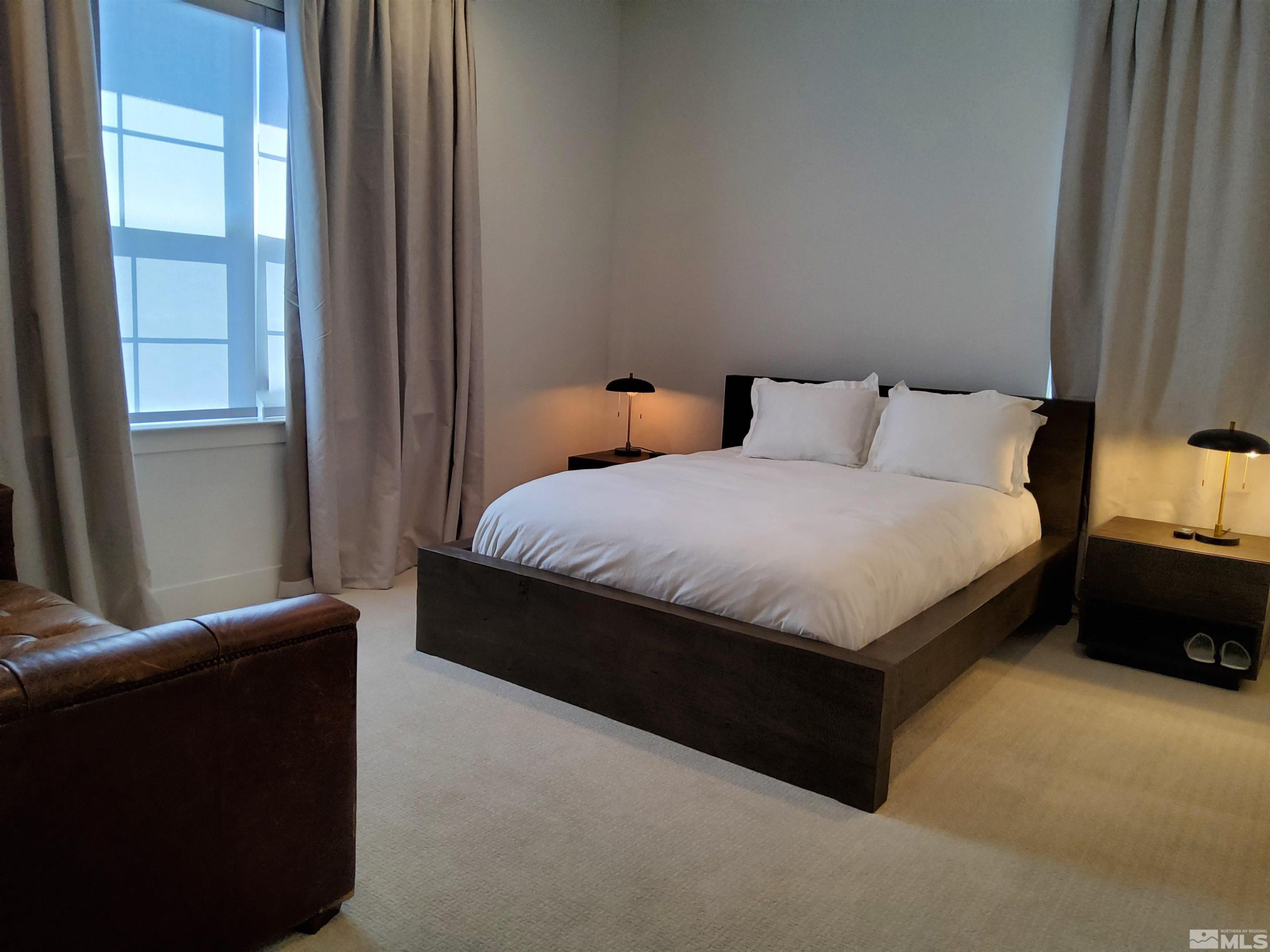 5449 Side Saddle Trail Reno, NV 89511 - Photo 24 of 35 a room with a bed and a couch