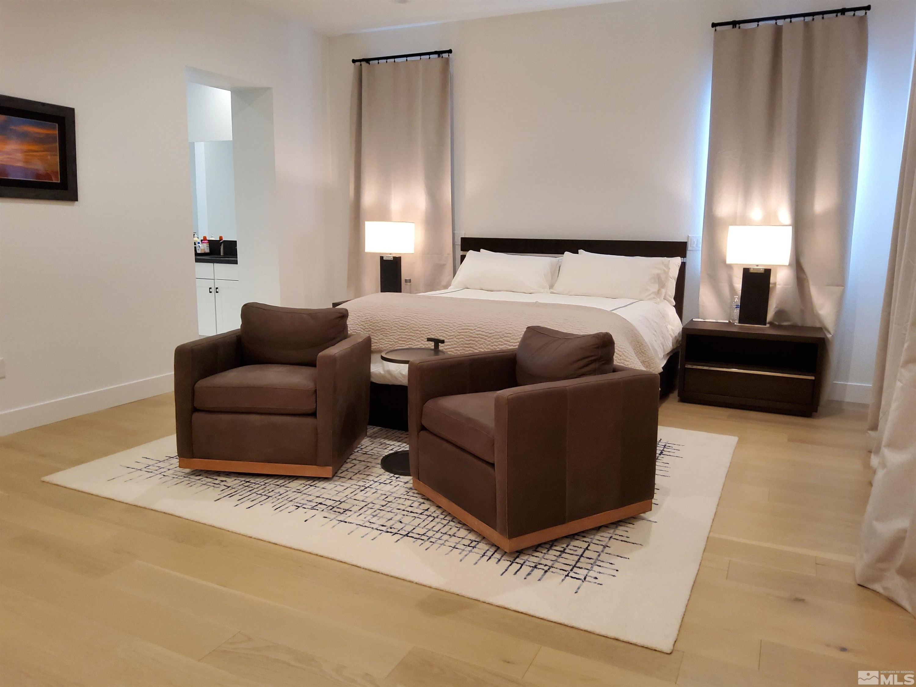 5449 Side Saddle Trail Reno, NV 89511 - Photo 26 of 35 a bedroom with furniture and a couch