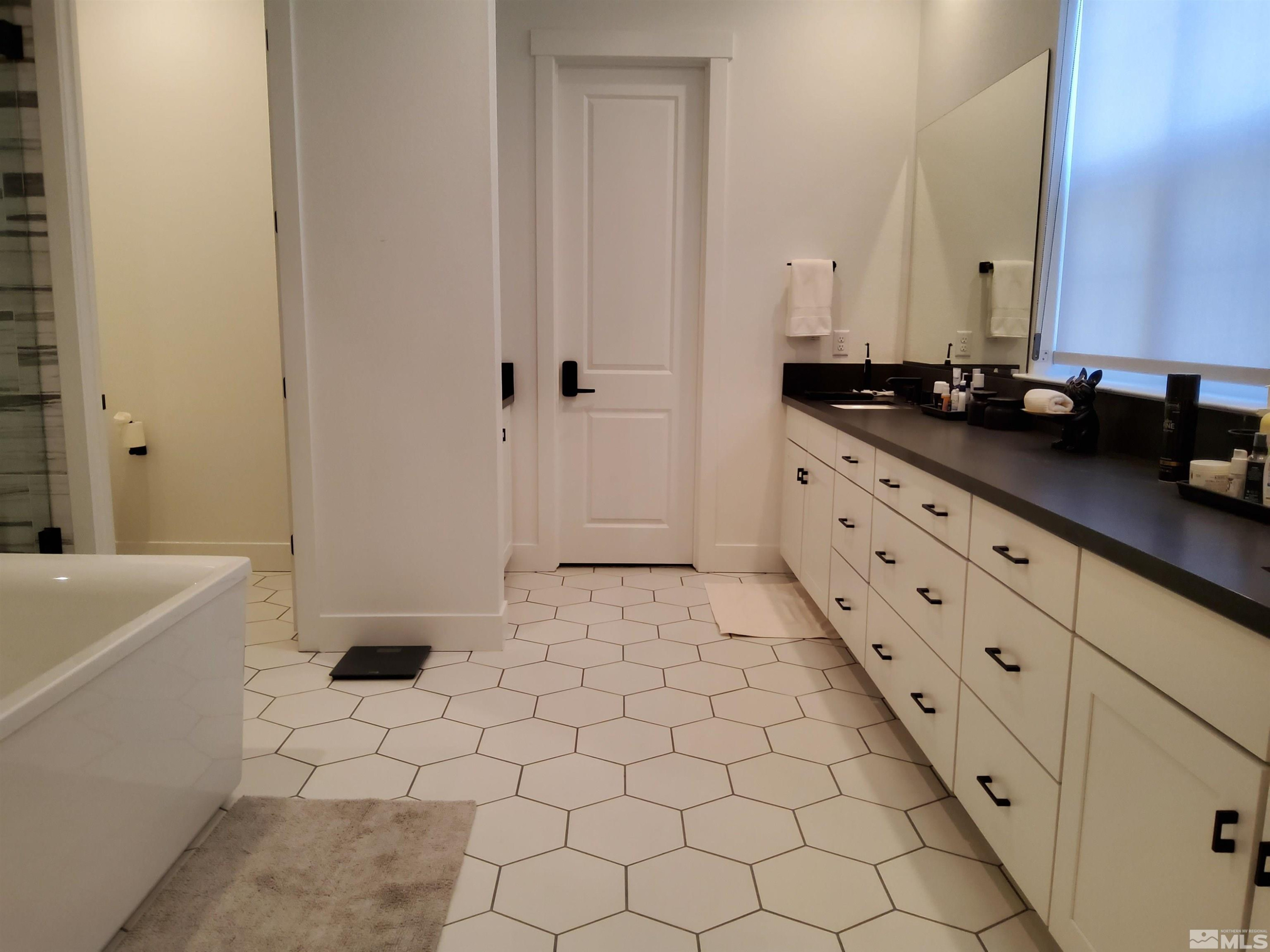 5449 Side Saddle Trail Reno, NV 89511 - Photo 27 of 35 a bathroom with a sink and a mirror