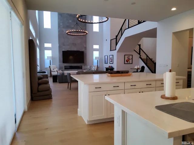 a view of living room with furniture and fireplace