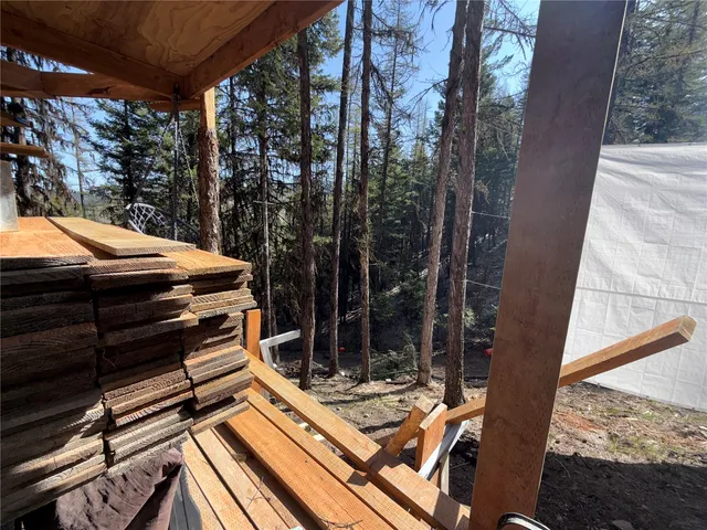 a view of a backyard with sitting area
