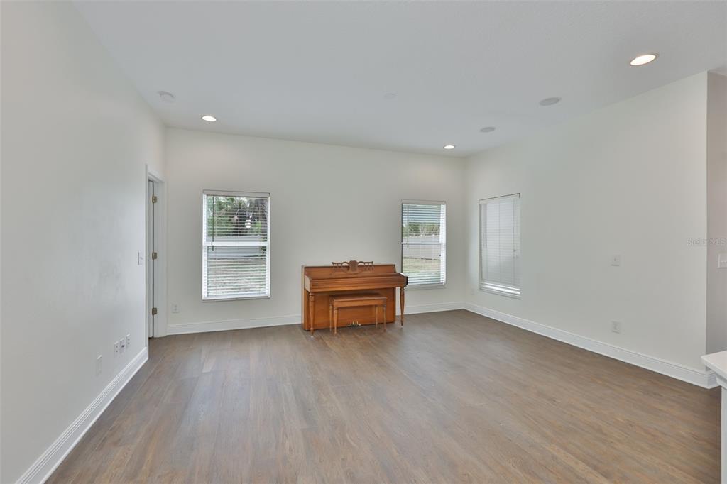 708 Coade Stone Drive Seffner, FL 33584 - Photo 16 of 48 an empty room with furniture and windows