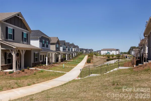 a view of a house with swimming pool