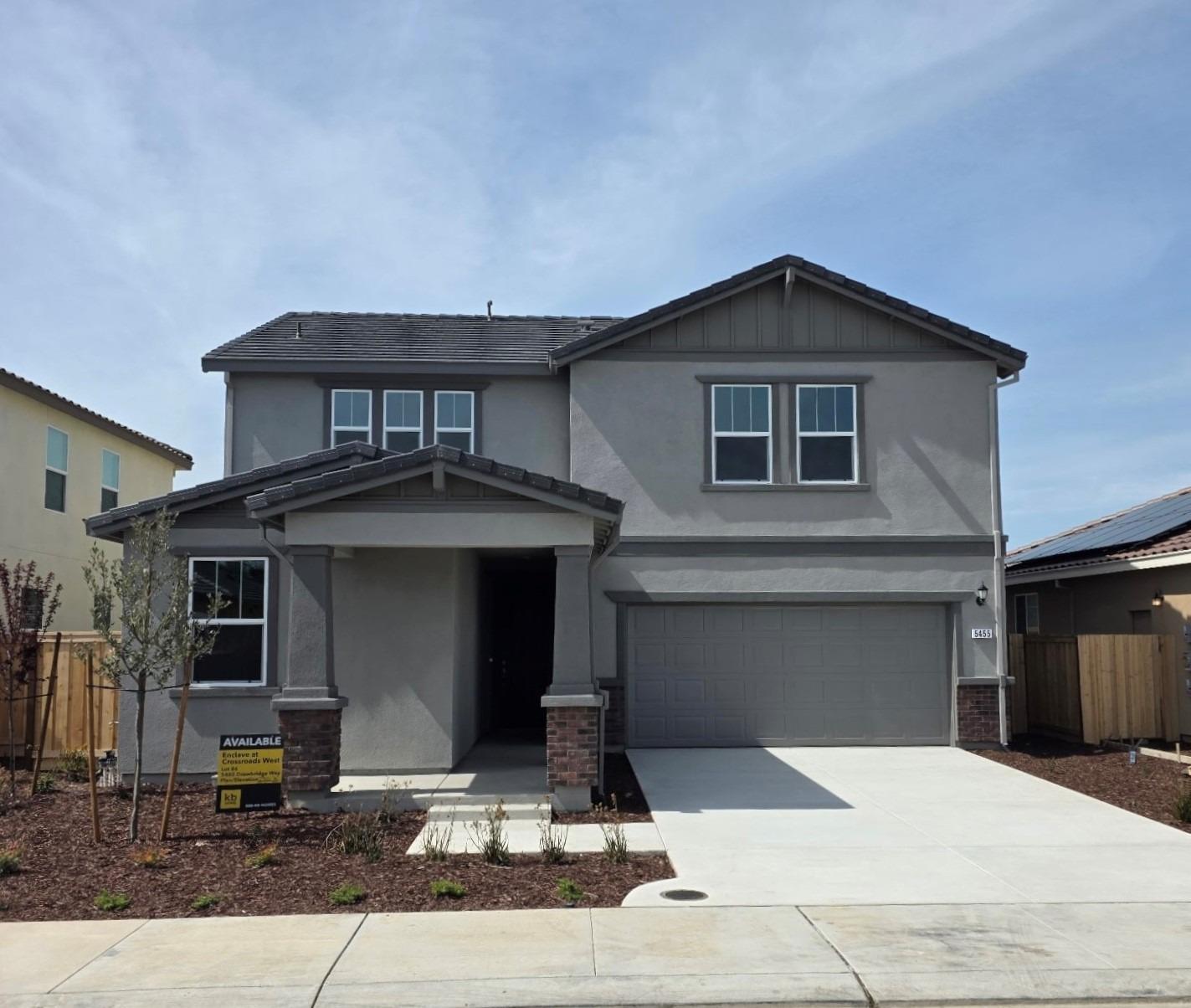 5455 Drawbridge Way Modesto, CA 95357 - Photo 1 of 1 a front view of a house with yard
