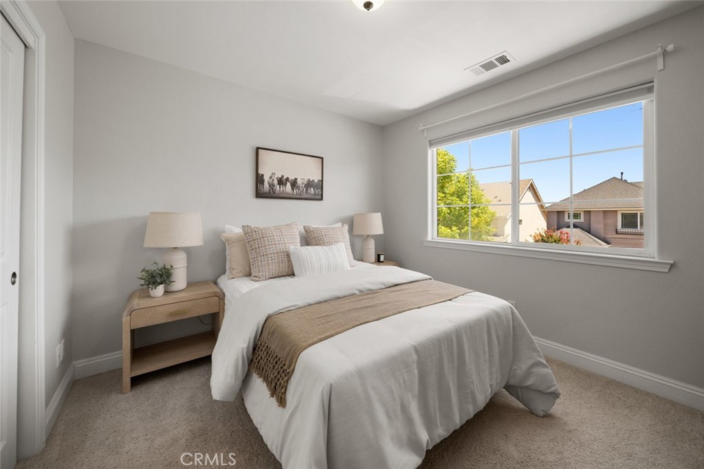 1012 La Costa Court Atascadero, CA 93422 - Photo 12 of 21 a bedroom with a bed and a window