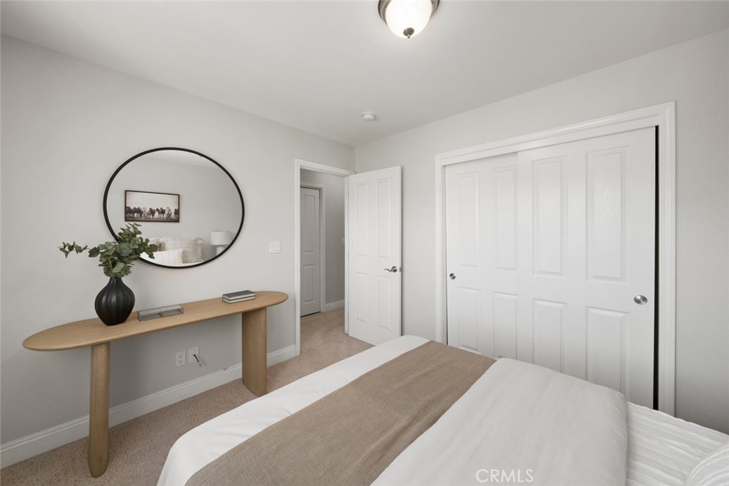 1012 La Costa Court Atascadero, CA 93422 - Photo 14 of 21 a bedroom with bed and a mirror