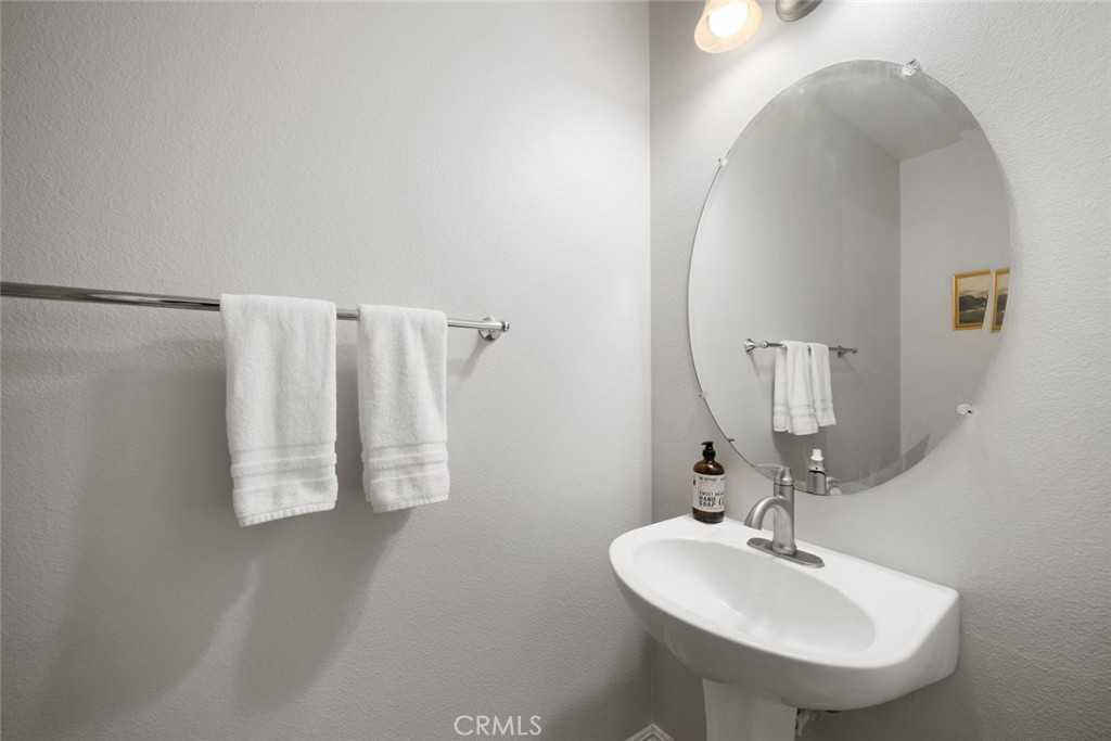 1012 La Costa Court Atascadero, CA 93422 - Photo 18 of 21 a bathroom with a sink and a mirror